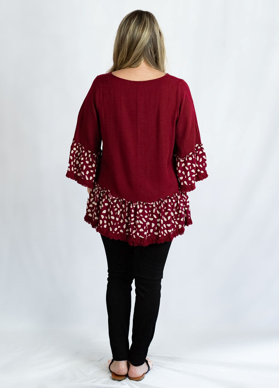 Linen Ruffled Hem Top with Animal Print Bell Sleeves by Umgee Clothing